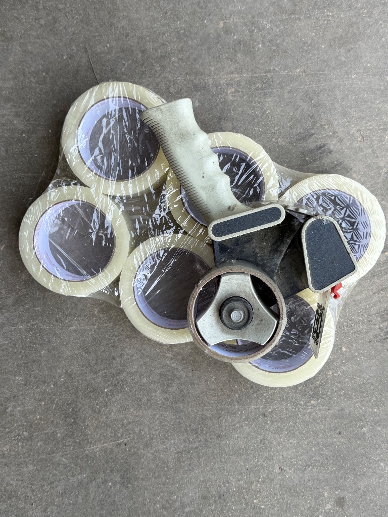 (1) Uline packing tape dispenser with 6 rolls of tape